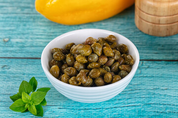 Pickled canned capers in the bowl