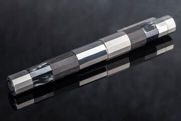 Branded pen with ink and nib in a box. Gift set. Office interior.