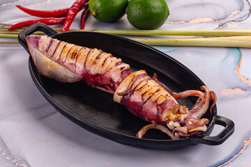 Tasty grilled wild squid with lime