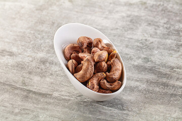 Unpeeled cashew nuts in the bowl