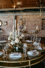 Elegant wedding reception table setting with flowers and candles