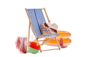 Toy ball, striped deck chair and beach accessories isolated on white background