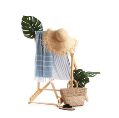 Striped deck chair, tropical leaves and beach accessories isolated on white background