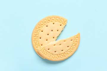 Broken sweet cookie on blue background