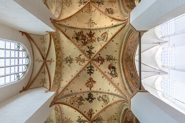 Medieval ceiling fresco. Gothic church architecture. Angelic ornament details.