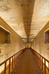 Long corridor of a Pharaoh tomb with wooden ground, in the famous Valley of the Kings, Luxor,...