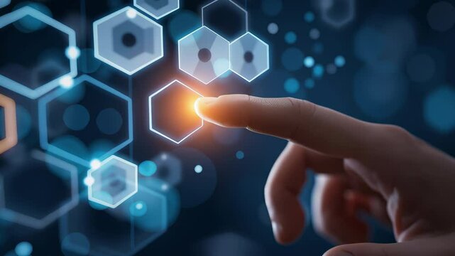 A person's hand is hovering over a blue and orange hexagon on a screen. The hand is positioned above the hexagon, almost touching it