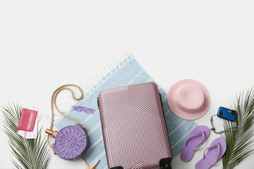 Composition with suitcase, passport and beach accessories isolated on white background