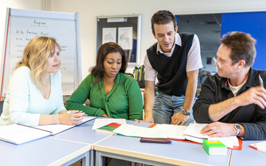 Adult Education: Small Group Learning. A group of mature students working together with their...
