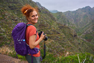 Hiker photographing landscape in Anaga