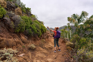 Hiker on volcanic trail in Tenerife