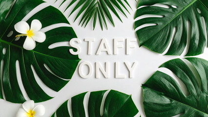STAFF ONLY Text in Dynamic Minimalist Style – Realistic Typography with Green Tropical Floral Leaves