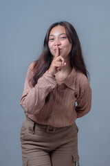 Portrait of an Indonesian woman making a 