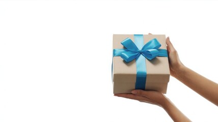 Woman s hands holding a small brown gift box tied with a blue ribbon