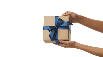 Woman s hands holding a small brown gift box tied with a blue ribbon
