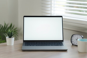 Mockup blank screen computer with blank white background. hand man using laptop contact. advertising text, blank screen laptop, white table with white wall background