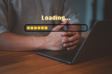 Person using a laptop for download to loading digital business data form website, while a digital...