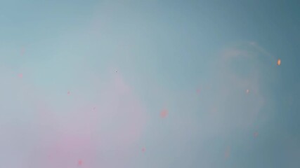 Colorful powder explosion on soft blue background, abstract design - Powered by Adobe