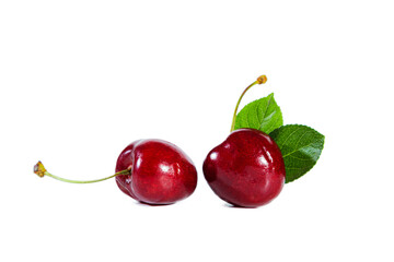 Ripe juicy cherry with  leaves isolated on white background.