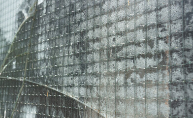 Old cracked reinforced glass closeup