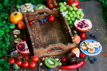 Wooden box with vegetables and fruits.