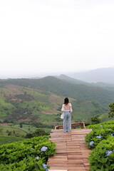 young woman walking in the mountains