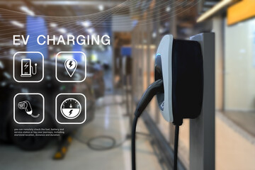 Electric vehicle charging station in focus with digital EV interface graphics overlaid