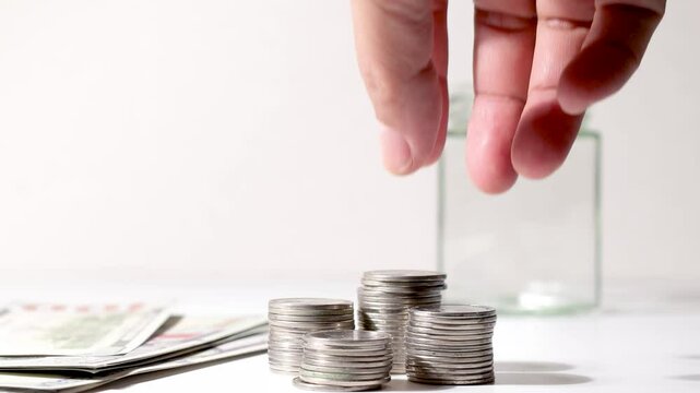 Hand Taking Out Money &ndash; Business Cost and Finance Management Concept