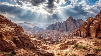 Sunlight pierces dramatic canyon landscape