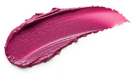 A close up of a smear of magenta lipstick on a white background in a studio setting indoors