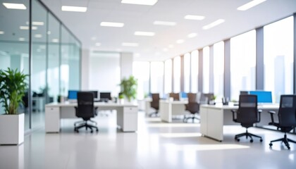 modern open-plan office with organized workstations, ergonomic chairs, computer monitors, and natural light enhancing a clean professional environment