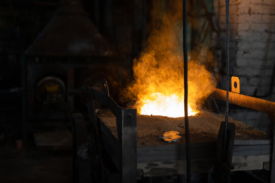 Ferrous metal billet is melted in an induction furnace closeup