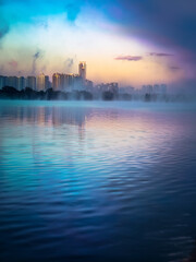 Naklejka premium Majestic water surface shimmering with gentle ripples beneath glowing magical skies