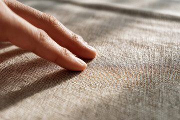 Hand Touching Textured Fabric
