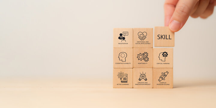 Future Skills Concept. Wooden block with skills icons critical thinking, adaptability, emotional and social intelligence and creative innovation. Digital transformation, reskilling and upskilling.