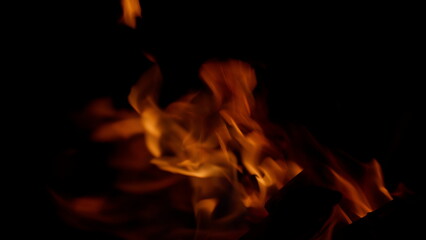 Dynamic Flames Gracefully Dancing in the Darkness, Creating a Mesmerizing Display of Energy