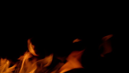 Dynamic and Vibrant Fire Flames Dancing on a Dark Black Background for Maximum Effect