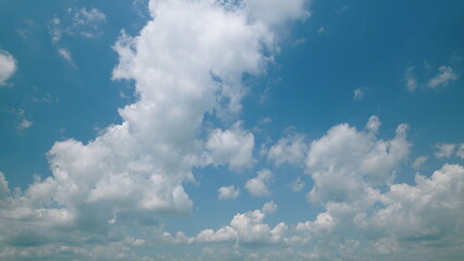 Time lapse. A Beautiful and Calming Cloudy Sky Can Be Seen Overhead with a Vibrant Blue Background