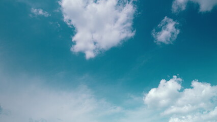 Time lapse. A Clear Blue Sky Interspersed with Fluffy White Clouds Creating a Picturesque View