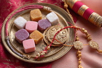 Rakhi or wristband in decorated thali with sweets