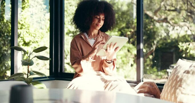 Happy, relax and woman on tablet in home for online website, social networking and internet. House, living room and African person on digital tech for reading news, ebook and watching videos