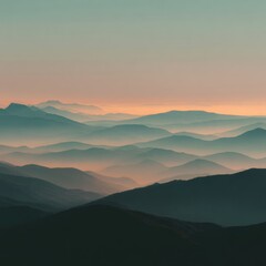 Obraz premium Serene Mountain Landscape with Layers of Fog and Soft Sunrise Light