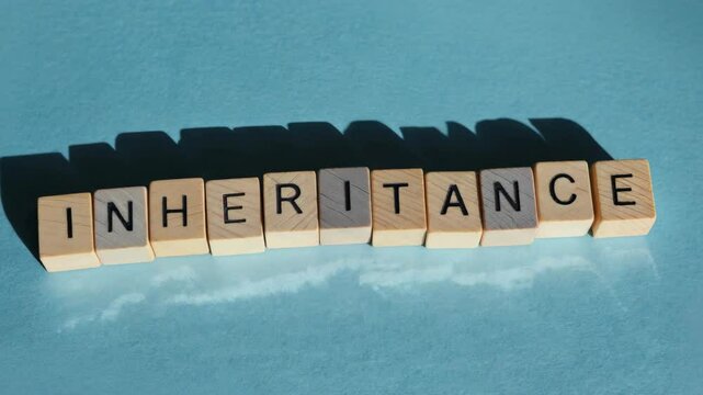 The word inheritance is written in wooden blocks