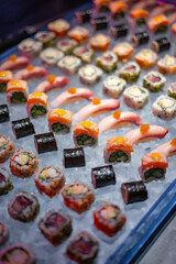 Assorted Sushi Rolls and Nigiri on Ice Display