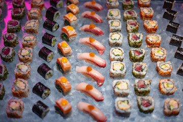 Assorted Sushi Rolls and Nigiri on Ice Display