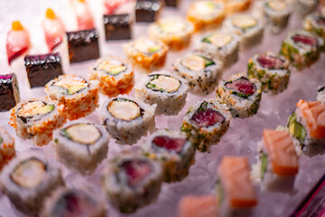 Assorted Sushi Rolls and Nigiri on Ice Display