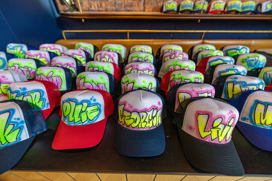 Graffiti Airbrushed Hats on Urban Art Background