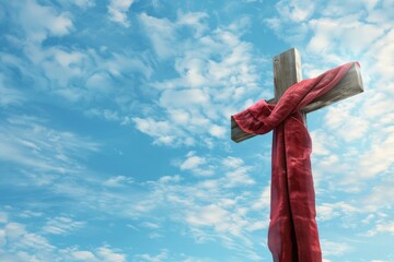 A red cloth is wrapped around the cross, symbolizing Jesus' death on Easter