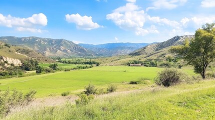 Idyllic mountain valley landscape with rolling hills and vibrant green pastures
