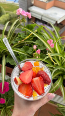 Colorful morning breakfast served in a stylish dessert bowl,chia topped with fresh berries. Light, minimalistic, and nutritious start to the day.